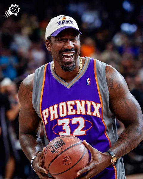 Amar'e Stoudemire laughing in his Phoenix #32 jersey, holding a basketball